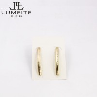 Delicate brushed gold bar post earring in brass